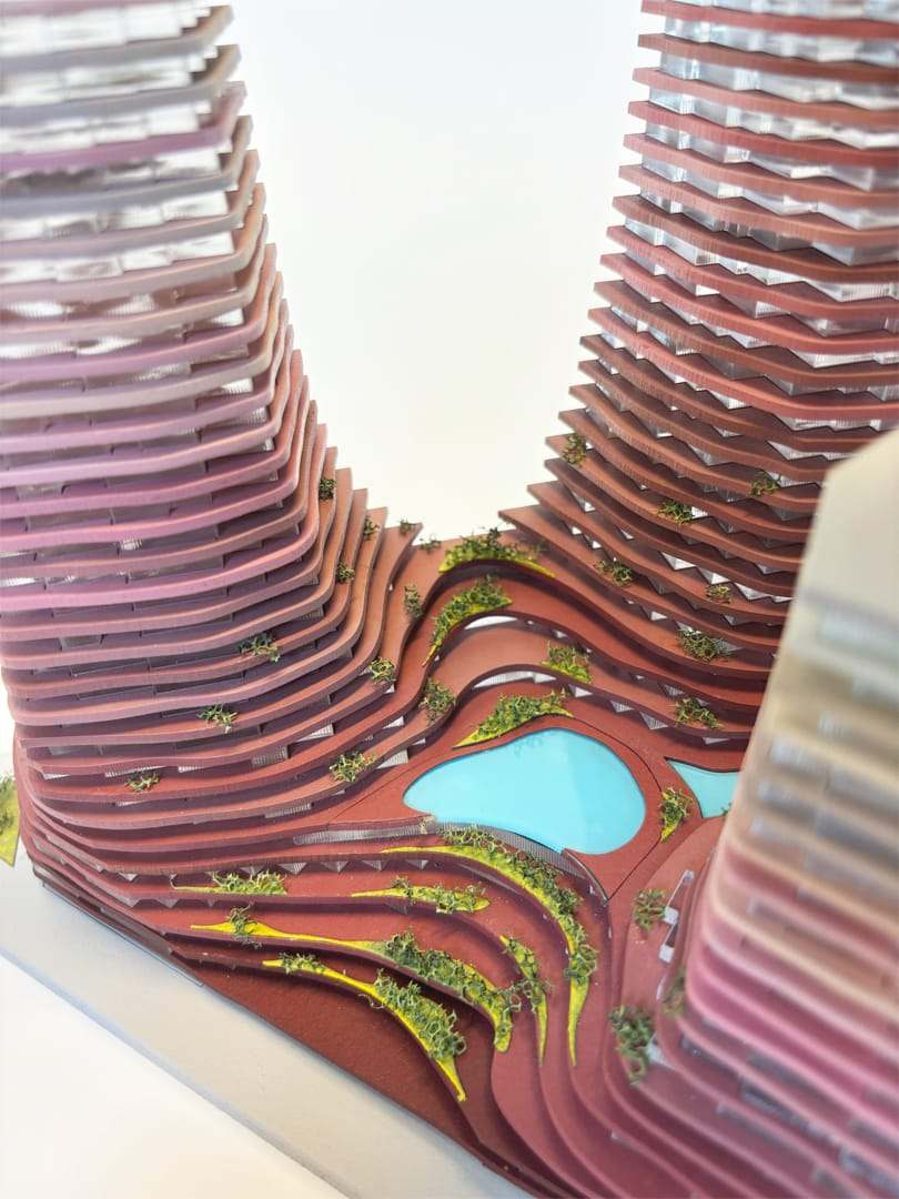 Close-up of the stacked slabs curving around the turquoise water
