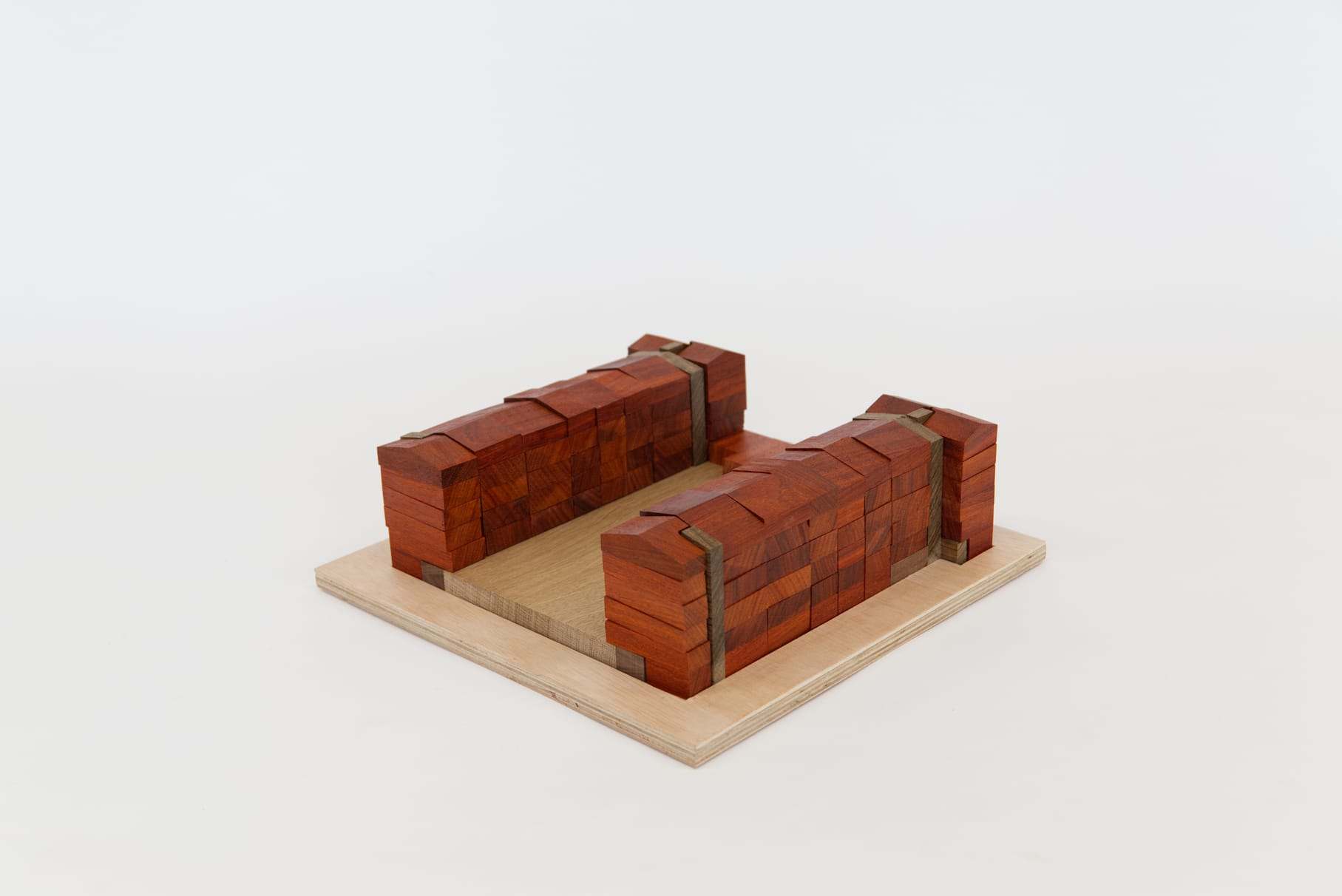 Model of the Nieuwenhuysenbuurt Chinese Puzzel: red wooden blocks forming two housing wings on a plywood base