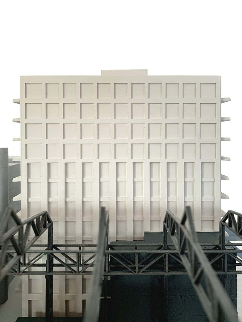 The square openings at the top of the facade, seen head-on