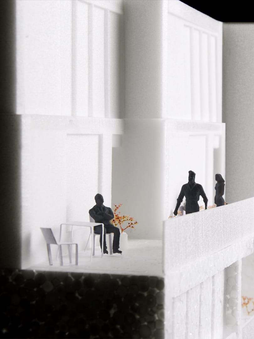 A resident at a table on one of the terraces