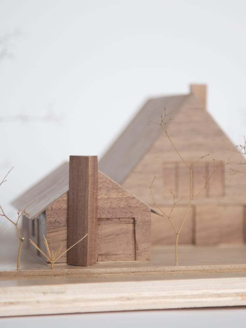 Close-up of the chimney standing against the sloping roof