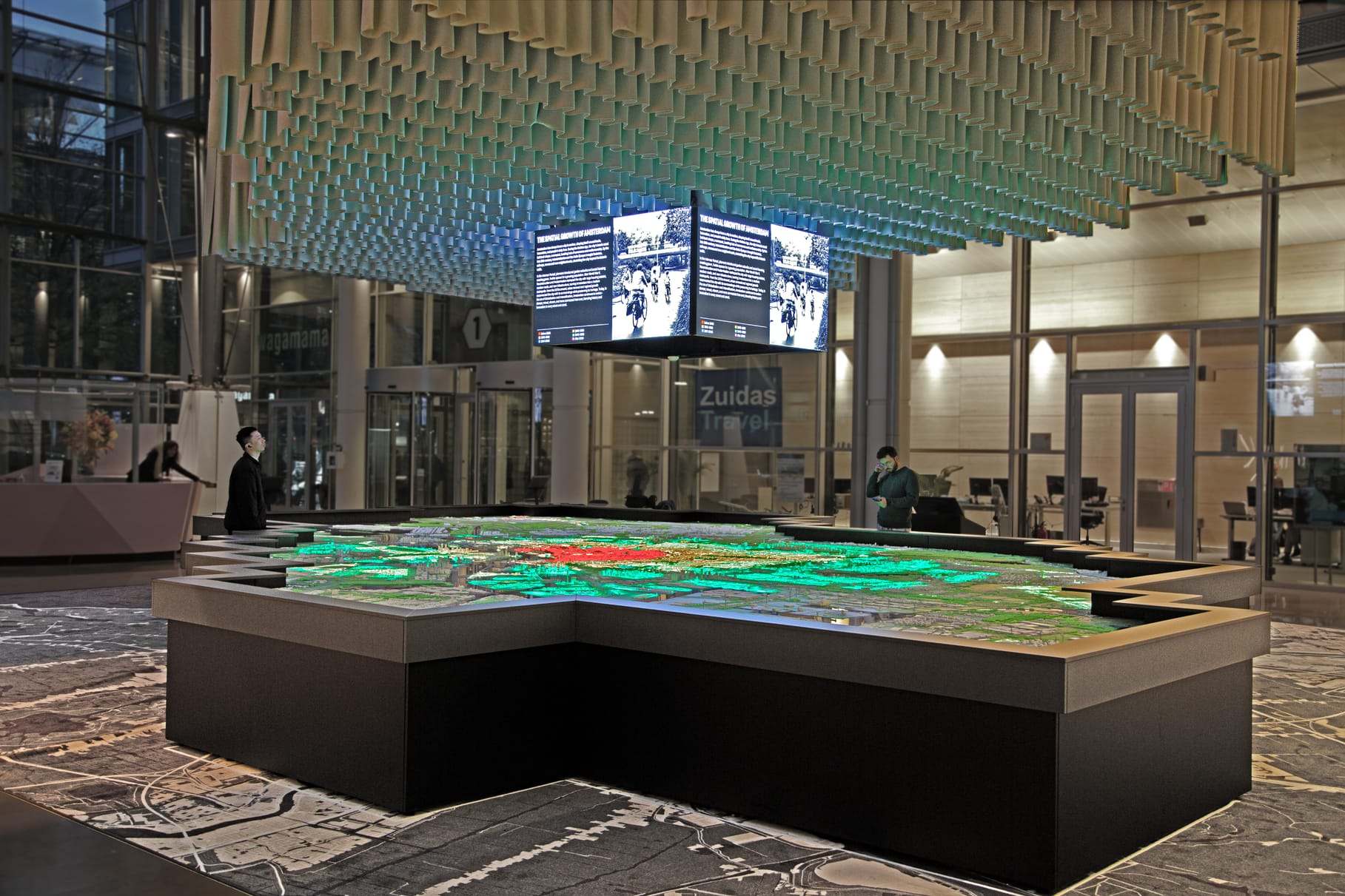 The model in the World Trade Center lobby, under the coffered ceiling