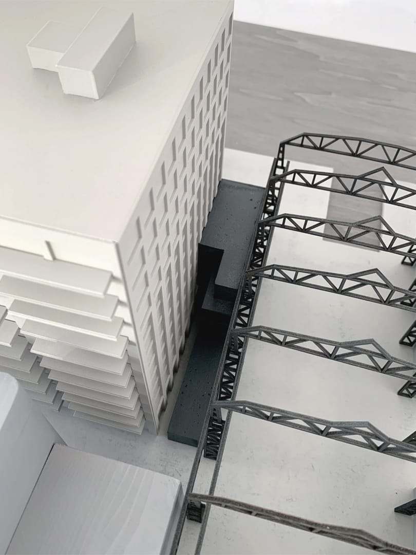 Top view down the facade onto the steel trusses of the hall
