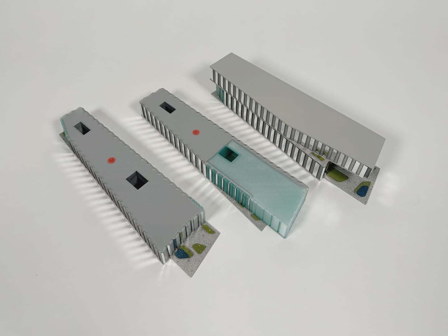 The tower model taken apart into three sections, lying on a white surface
