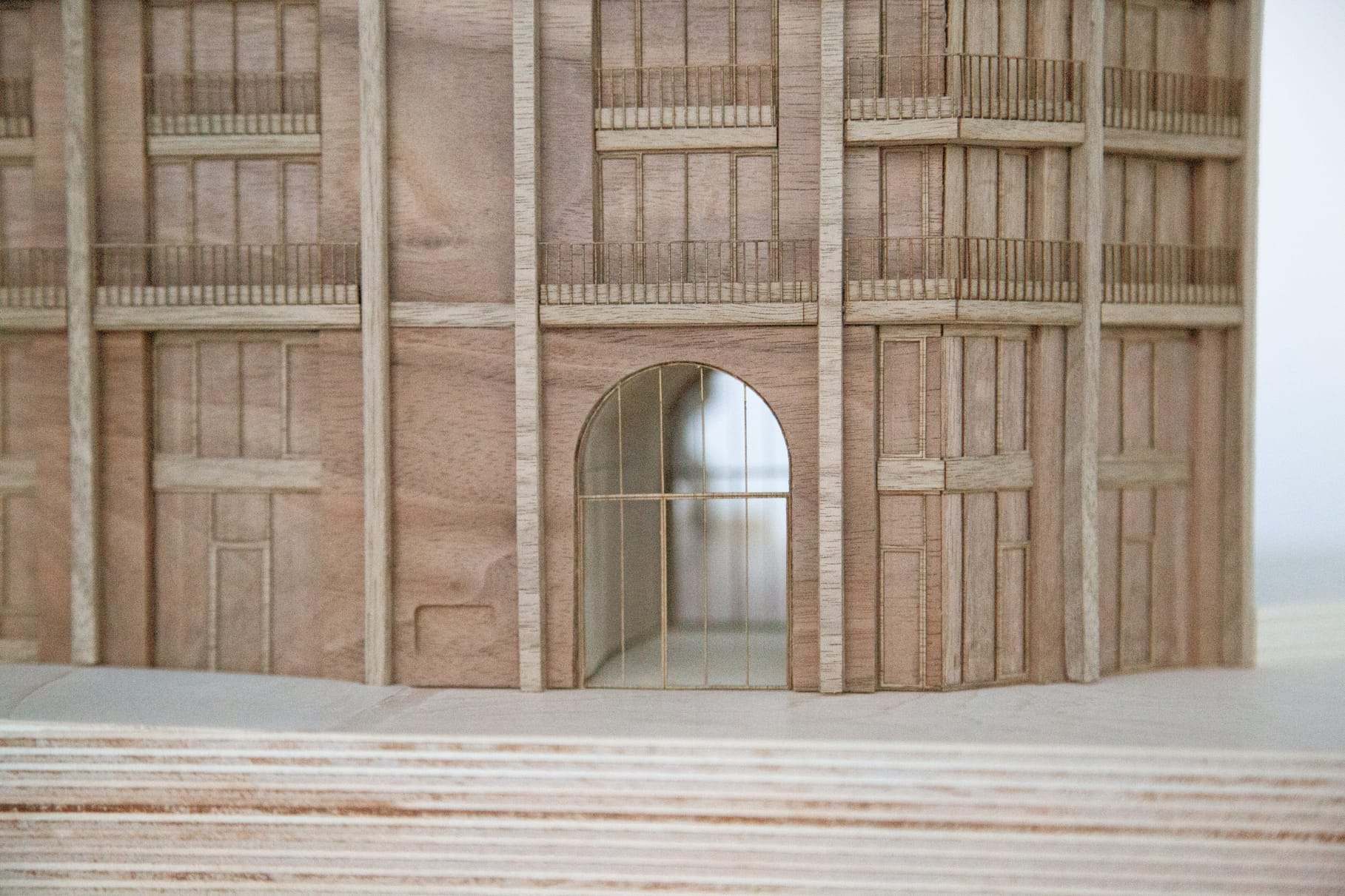 Detail of the arched entrance passage carved through the base of the walnut model