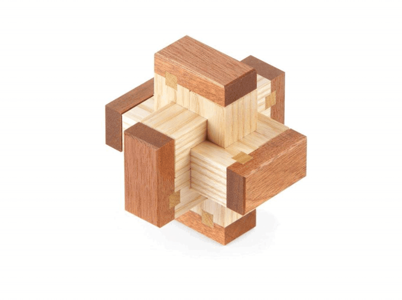 The assembled Chinese puzzle, a wooden cross-shaped knot in pale and dark wood on a white background