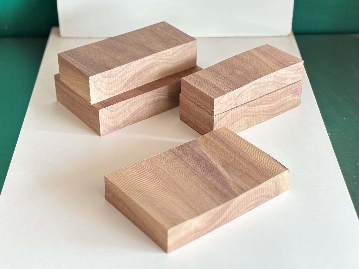 Several walnut blocks lying on a white surface