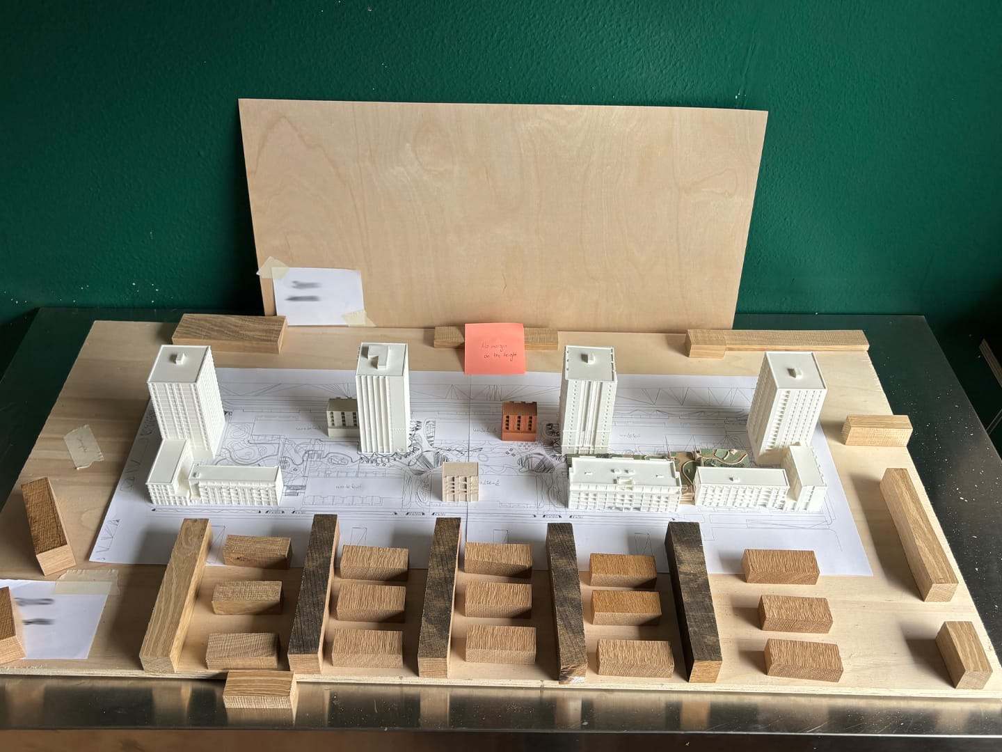 The De Vonk model in progress: white towers and wooden blocks on a plywood board