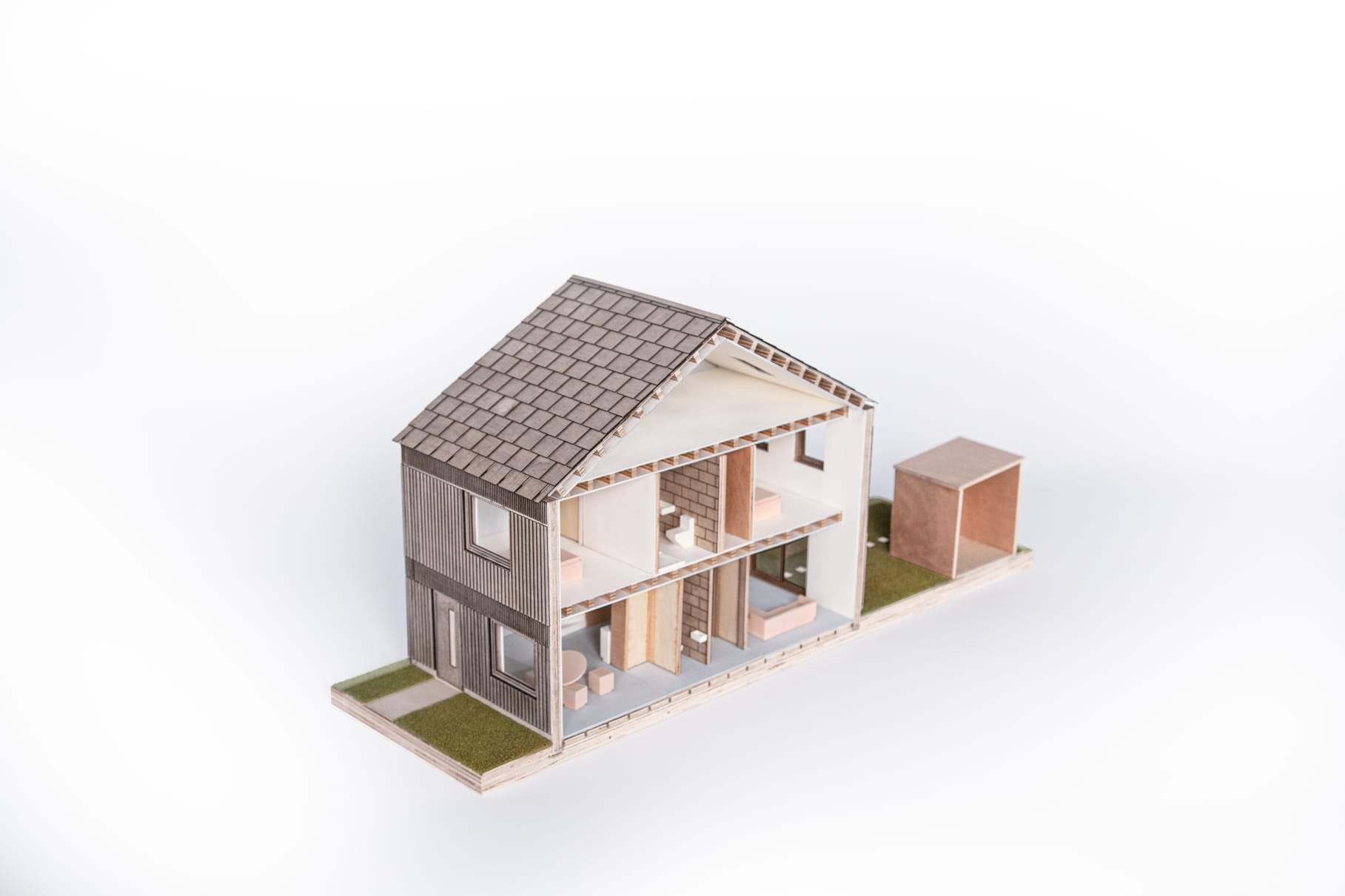 Three-quarter cutaway with the storage shed alongside