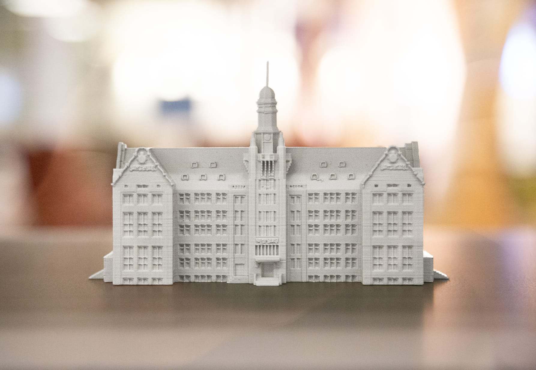 A single 3D-printed landmark building with its tower, photographed on the model base