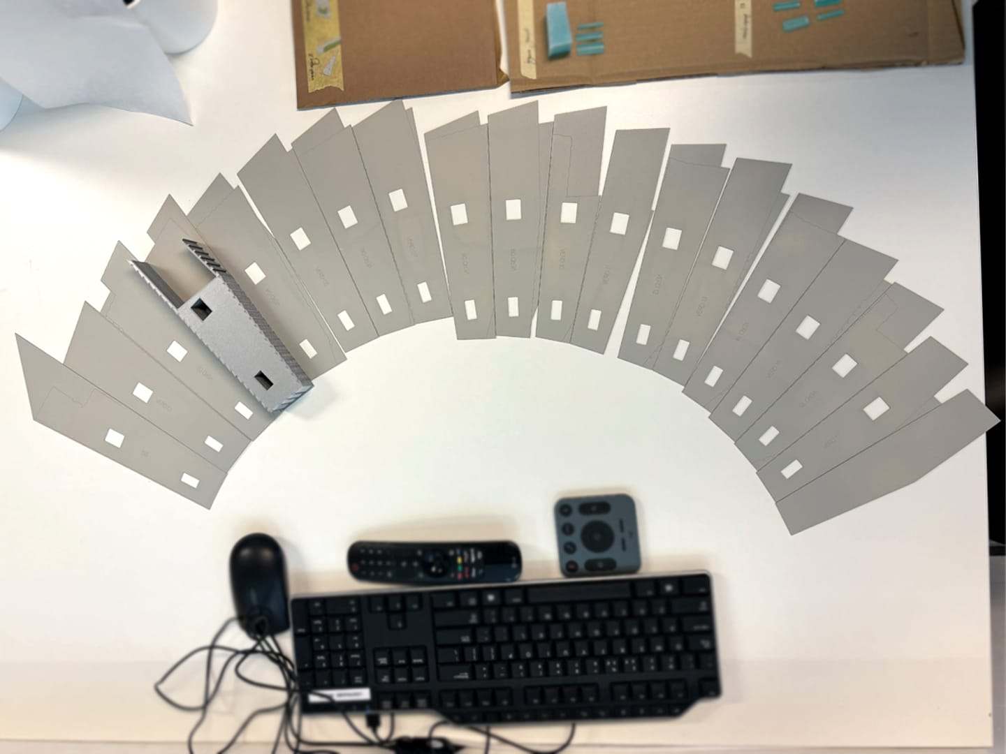 The aluminium facade panels laid out in a fan
