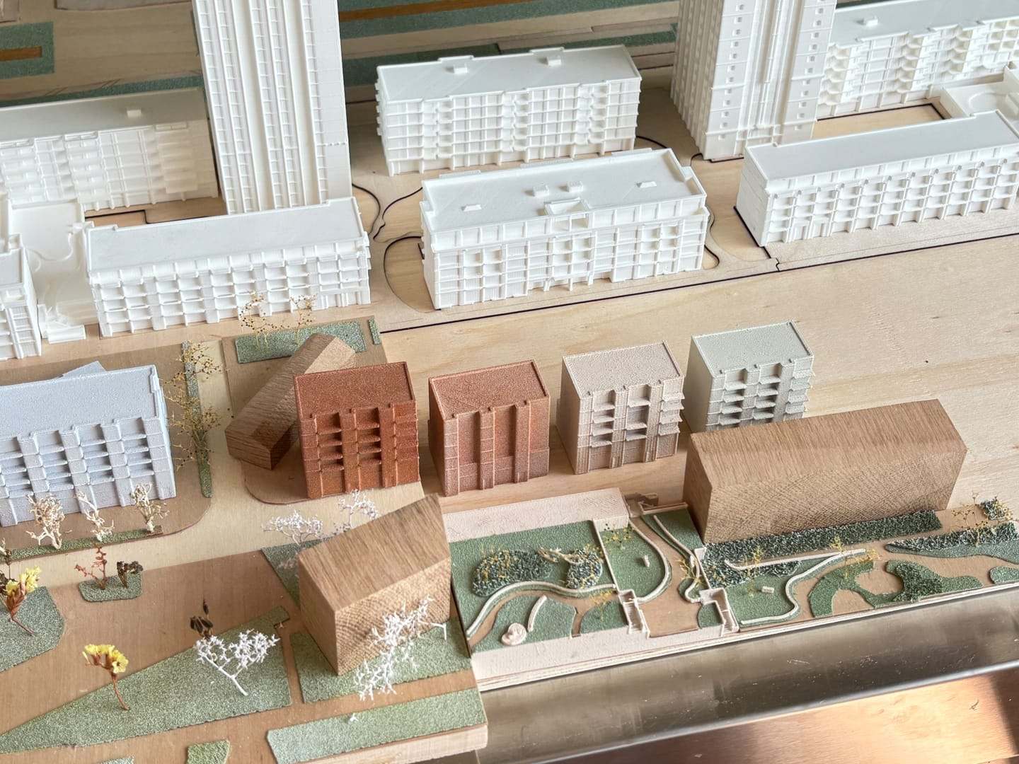 The De Vonk model in progress with white housing blocks and brick-coloured volumes