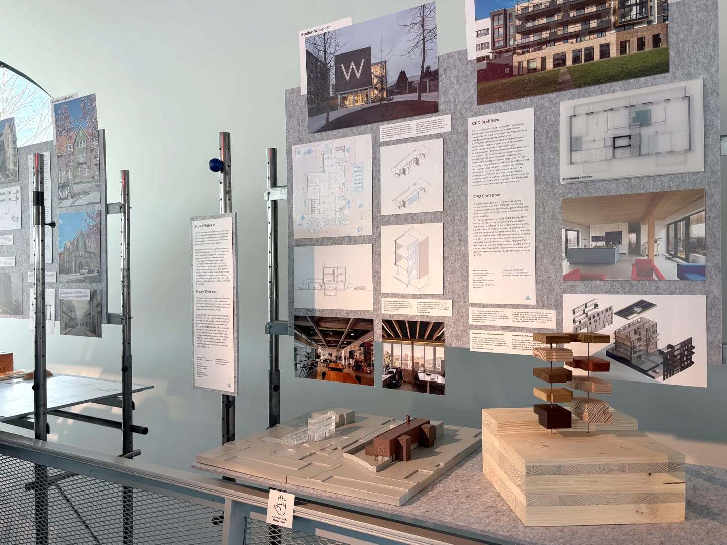 The maquette on show at the exhibition, with the project panels behind it
