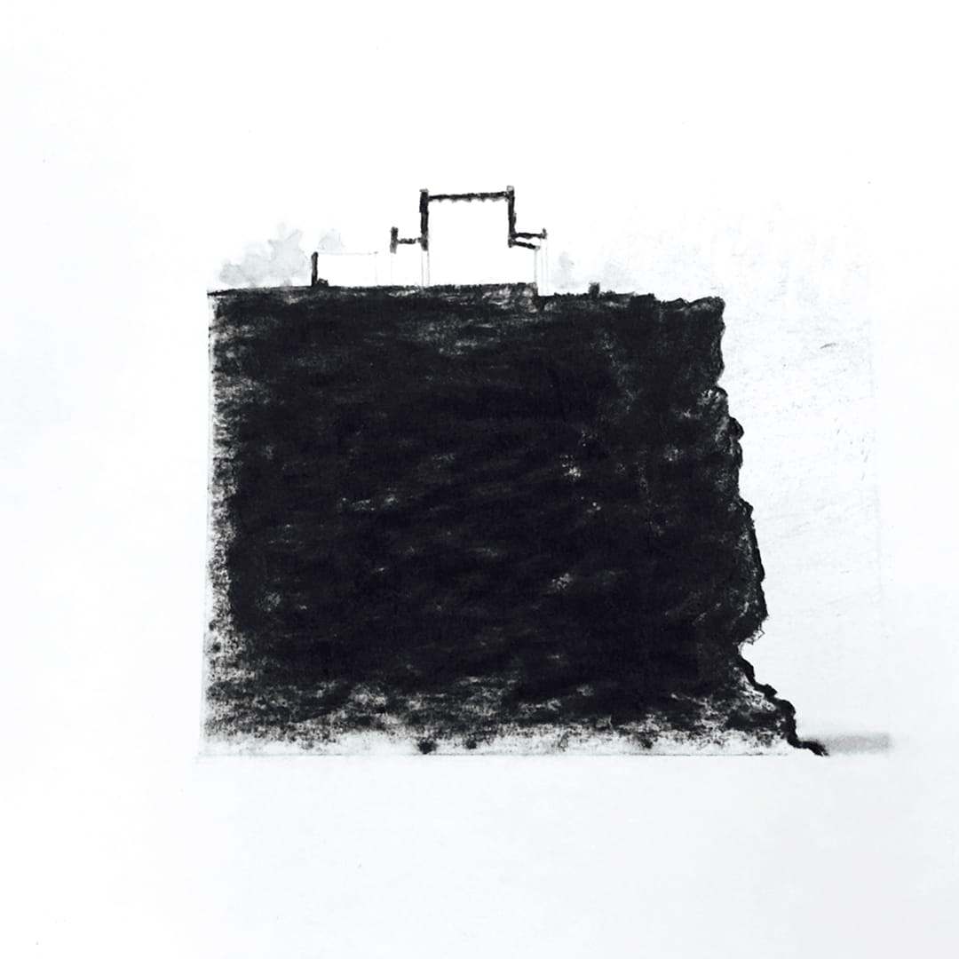 Dense black charcoal drawing of a block with a small structure on top