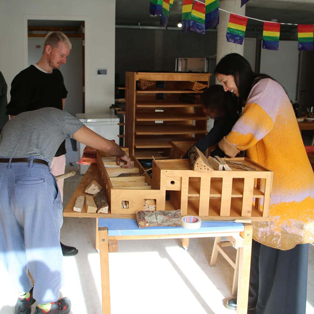Two residents filling the compartments during the hands-on workshop