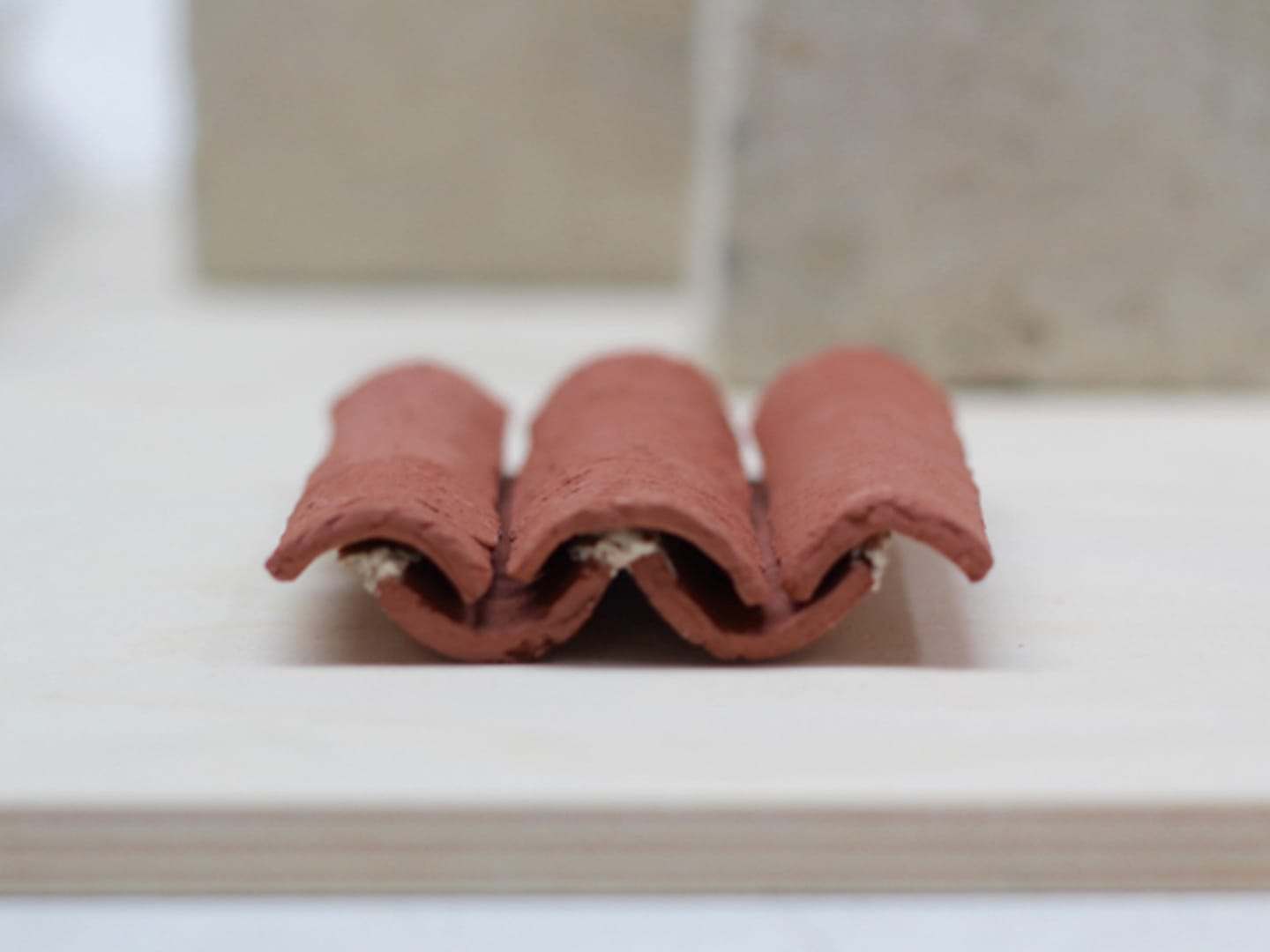 Hand-moulded terracotta roof tiles, modelled at full scale