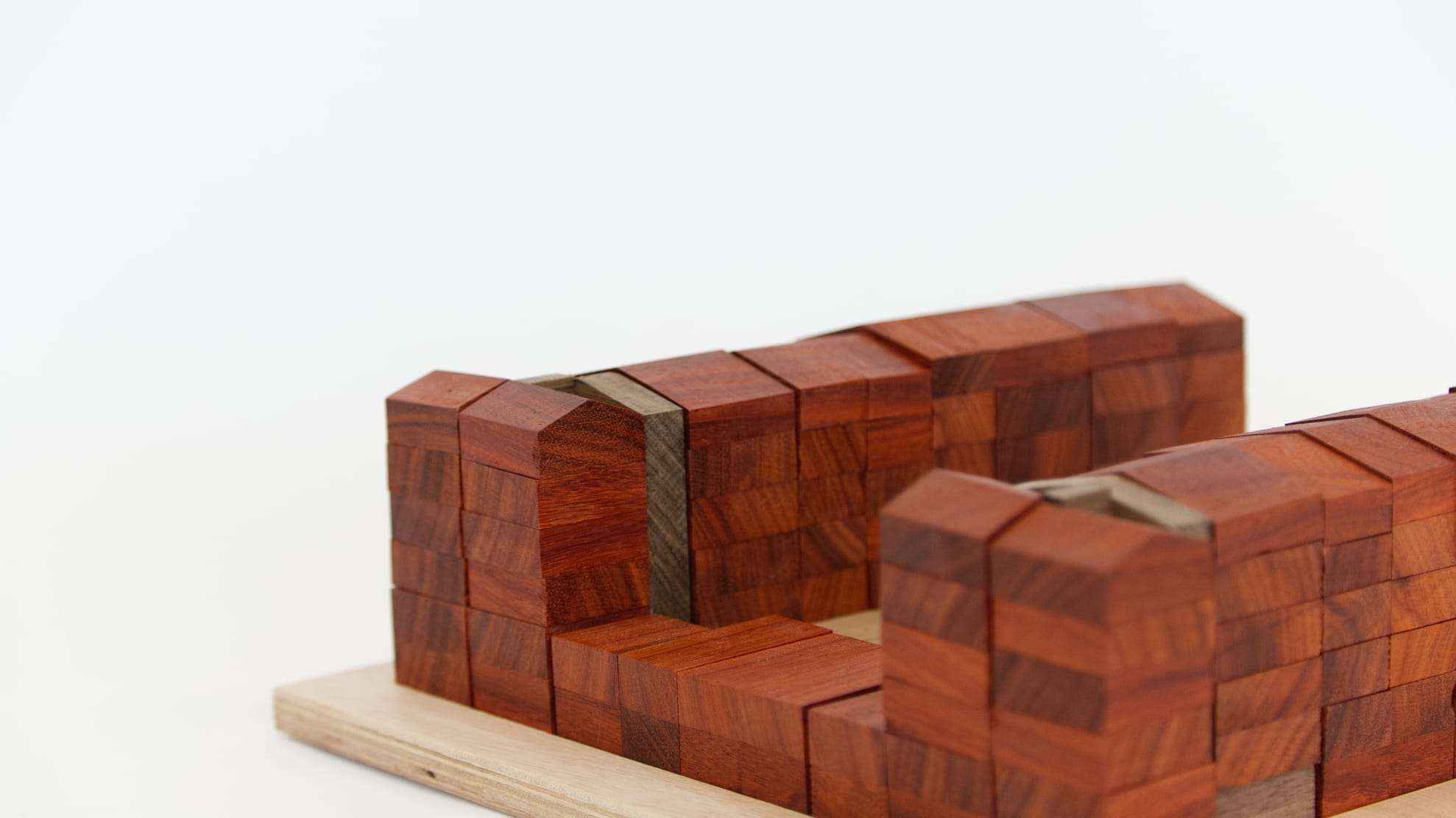 Close-up of the stacked red wooden blocks of the housing wing