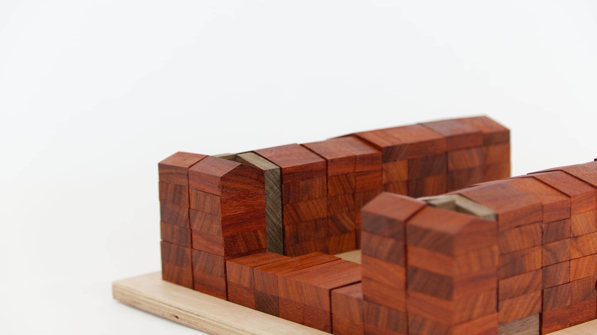 Close-up of the stacked red wooden blocks of the housing wing
