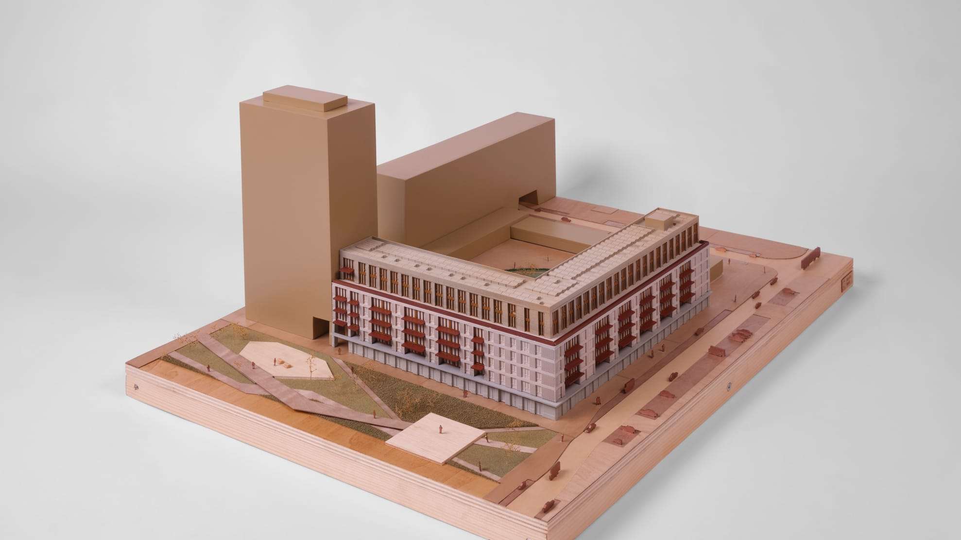 1:200 presentation model of De Bundel: a long block with a tower, on a plywood site base