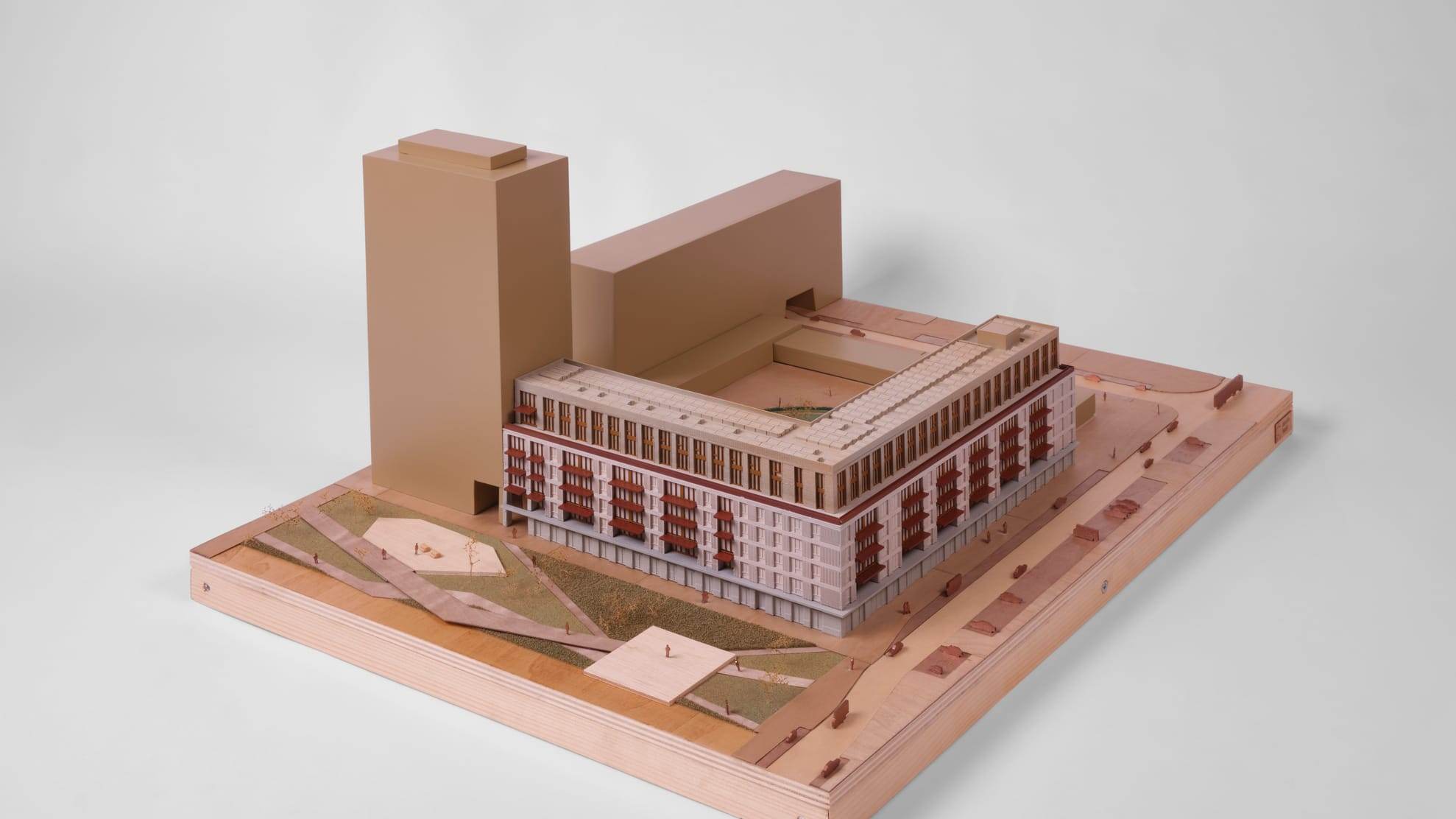 1:200 presentation model of De Bundel: a long block with a tower, on a plywood site base