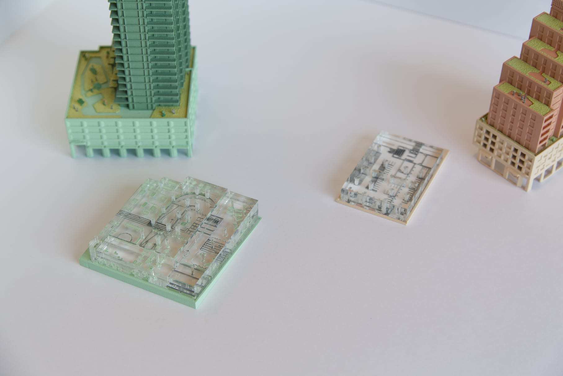 The transparent acrylic plinths in front of both towers